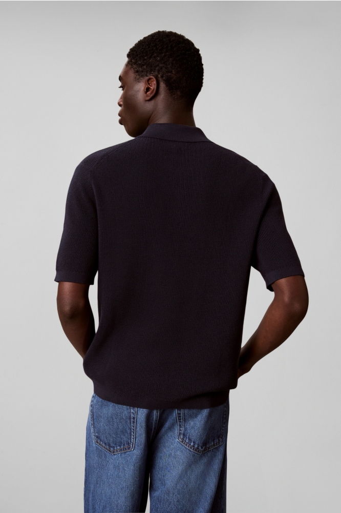 Calvin Klein blauwe heren polo | Model achteraanzicht