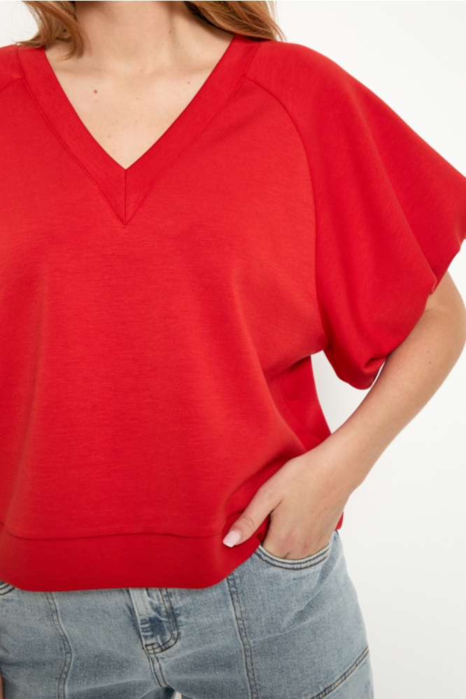 Peppercorn rode dames sweater | Close up