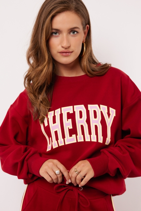 Fluresk rode dames sweater | Model vooraanzicht