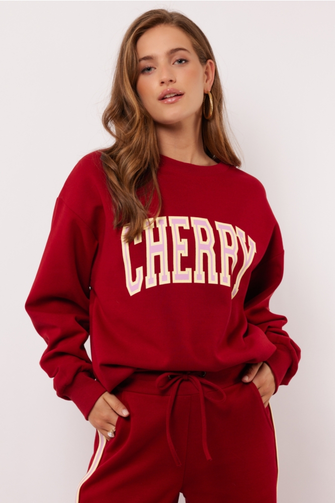 Fluresk rode dames sweater | Model vooraanzicht