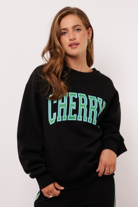 Fluresk zwarte dames sweater | Model vooraanzicht