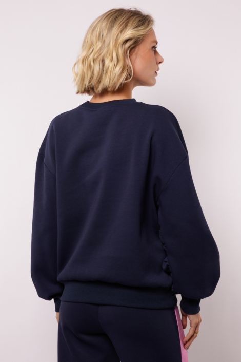Fluresk blauwe dames sweater | Model achteraanzicht