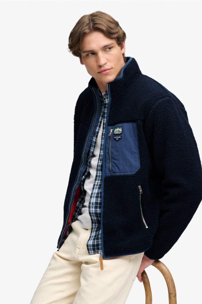 Superdry blauwe heren vest | Model zijaanzicht