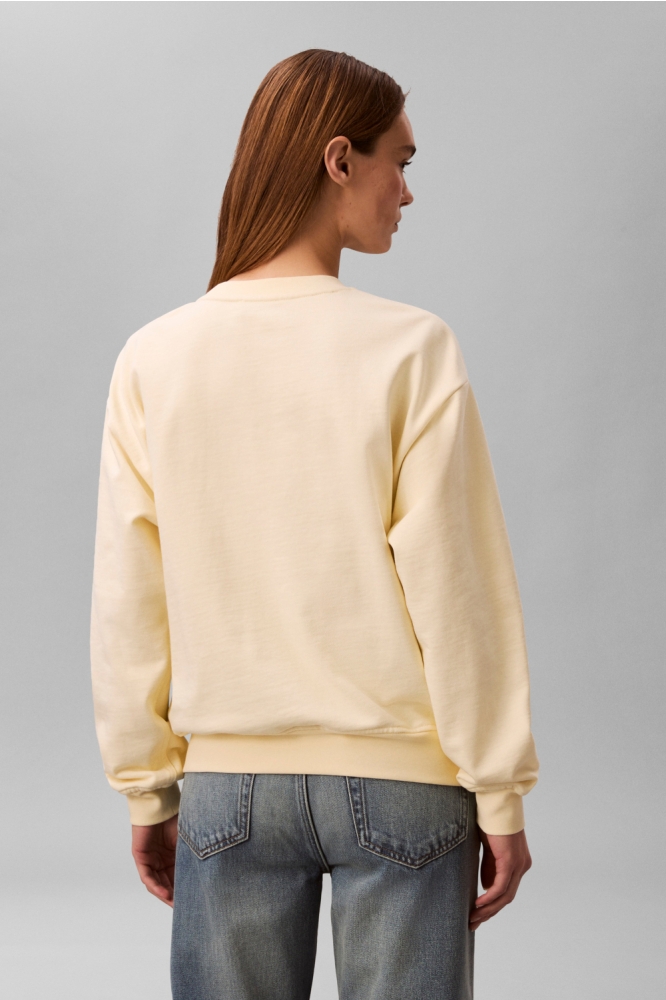 Calvin Klein gele dames sweater | Model achteraanzicht