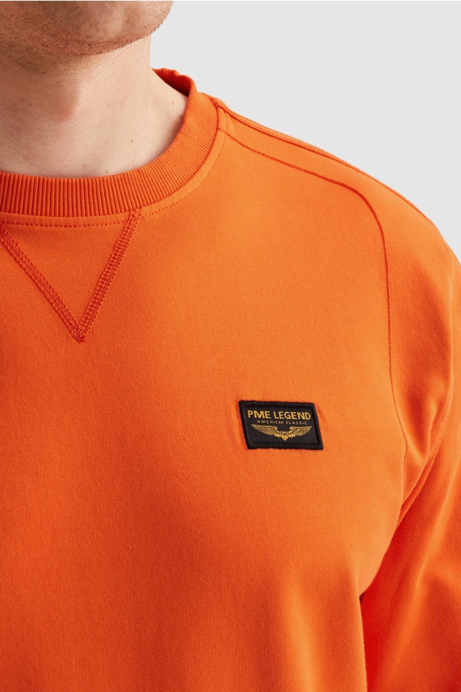 PME legend oranje heren sweater | Close up