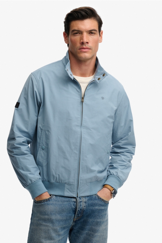 Superdry blauwe heren jas | Model vooraanzicht