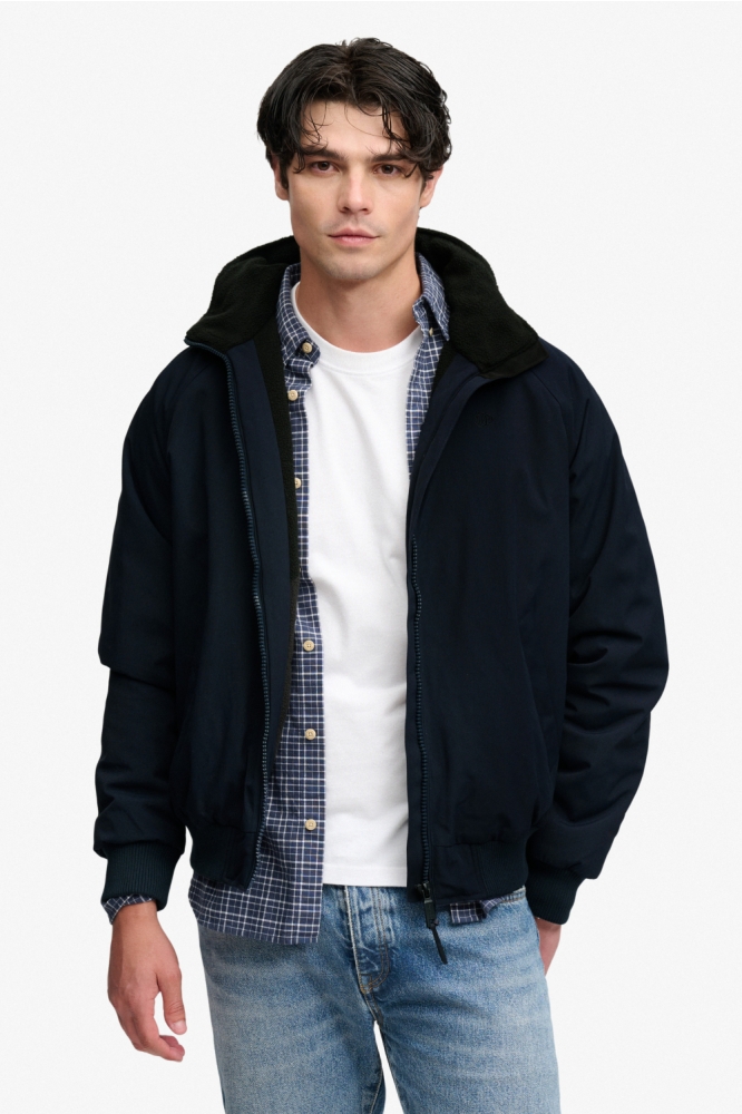 Superdry blauwe heren jas | Model vooraanzicht