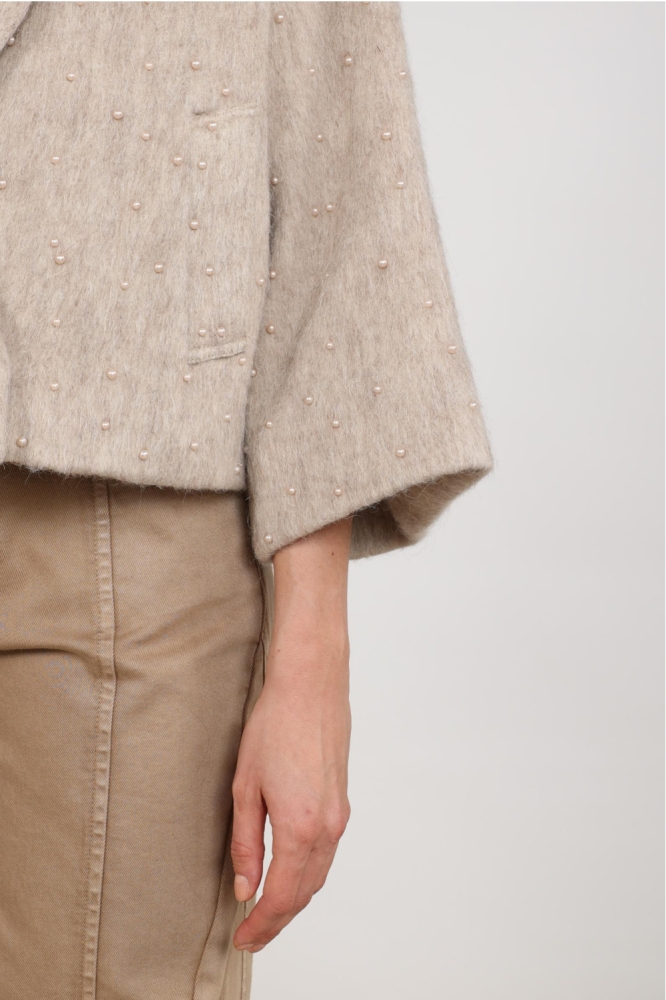 Nukus zand dames jas | Close up