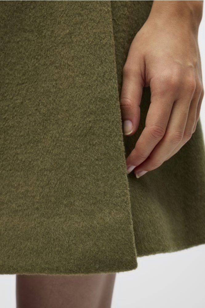 Object groene dames rok | Close up