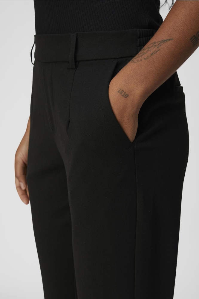 Object zwarte dames broek | Close up