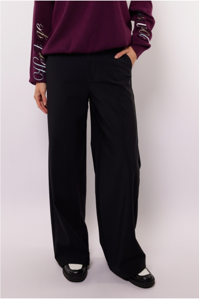 Fluresk zwarte dames broek | Model vooraanzicht