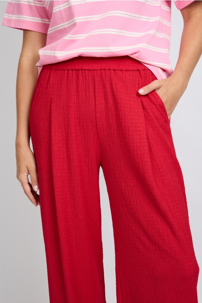 Fluresk blauwe dames broek | Close up