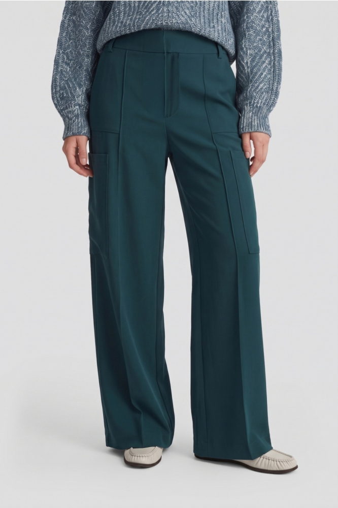 Fluresk groene dames broek | Model vooraanzicht