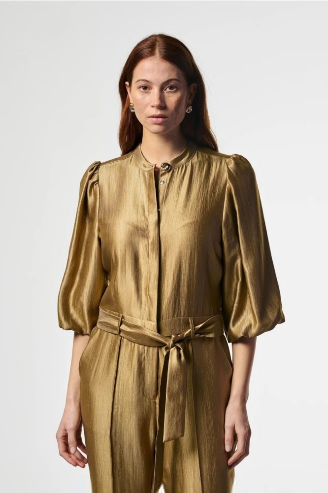 Aaiko gouden dames jumpsuit | Close up